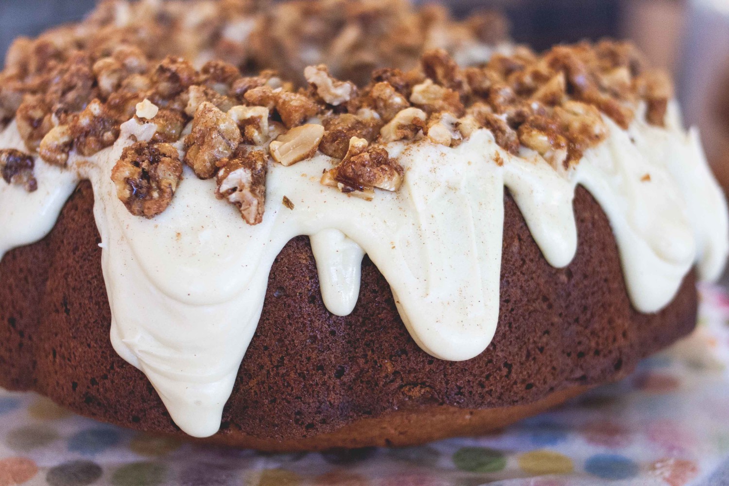 Butternut squash spice cake with white chocolate + maple ganache topped w/ candied maple walnuts