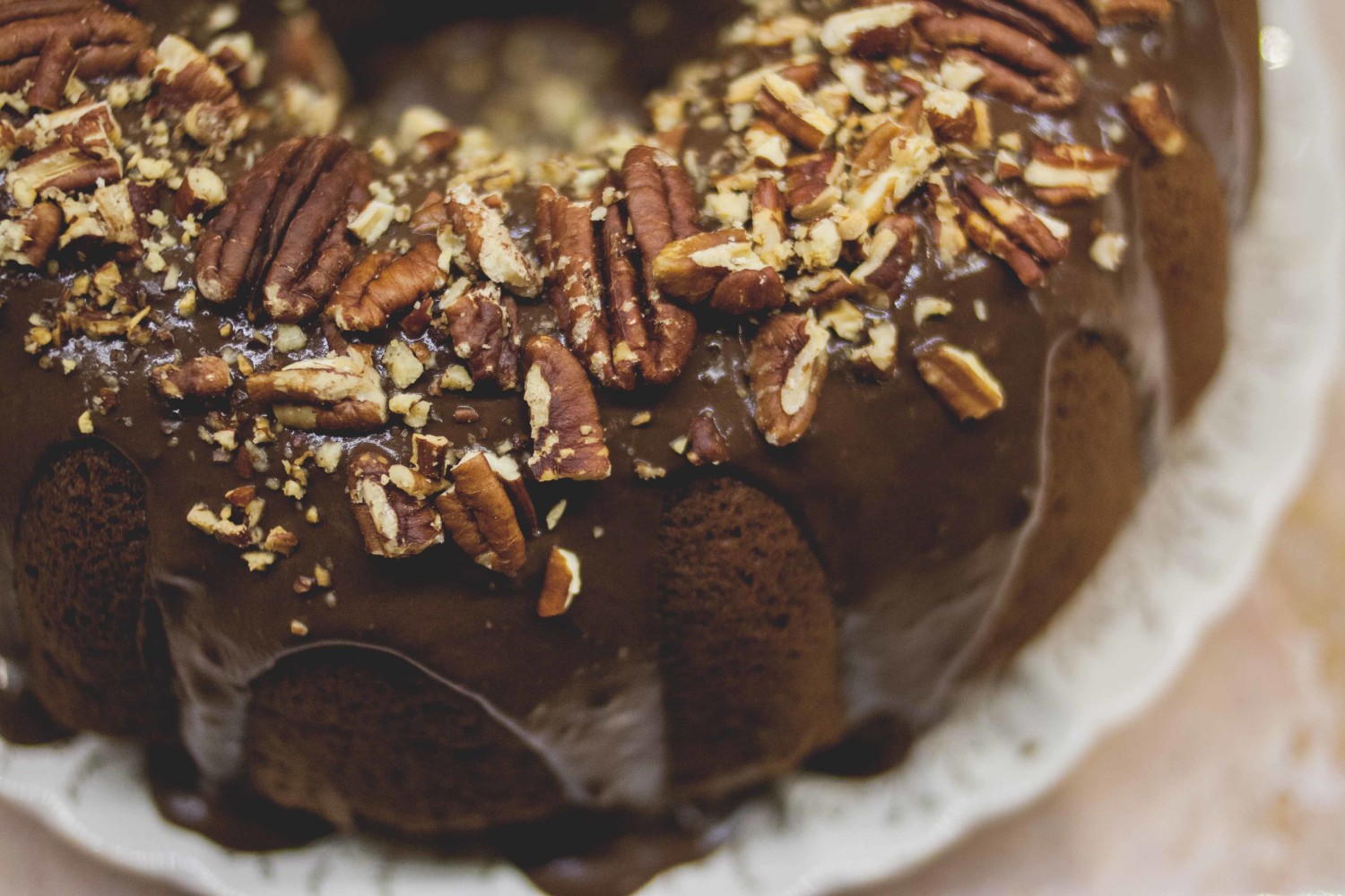 Whole grain pumpkin spice cake with dark chocolate chunks + toasted pecans topped with dark chocolate & coconut ganache