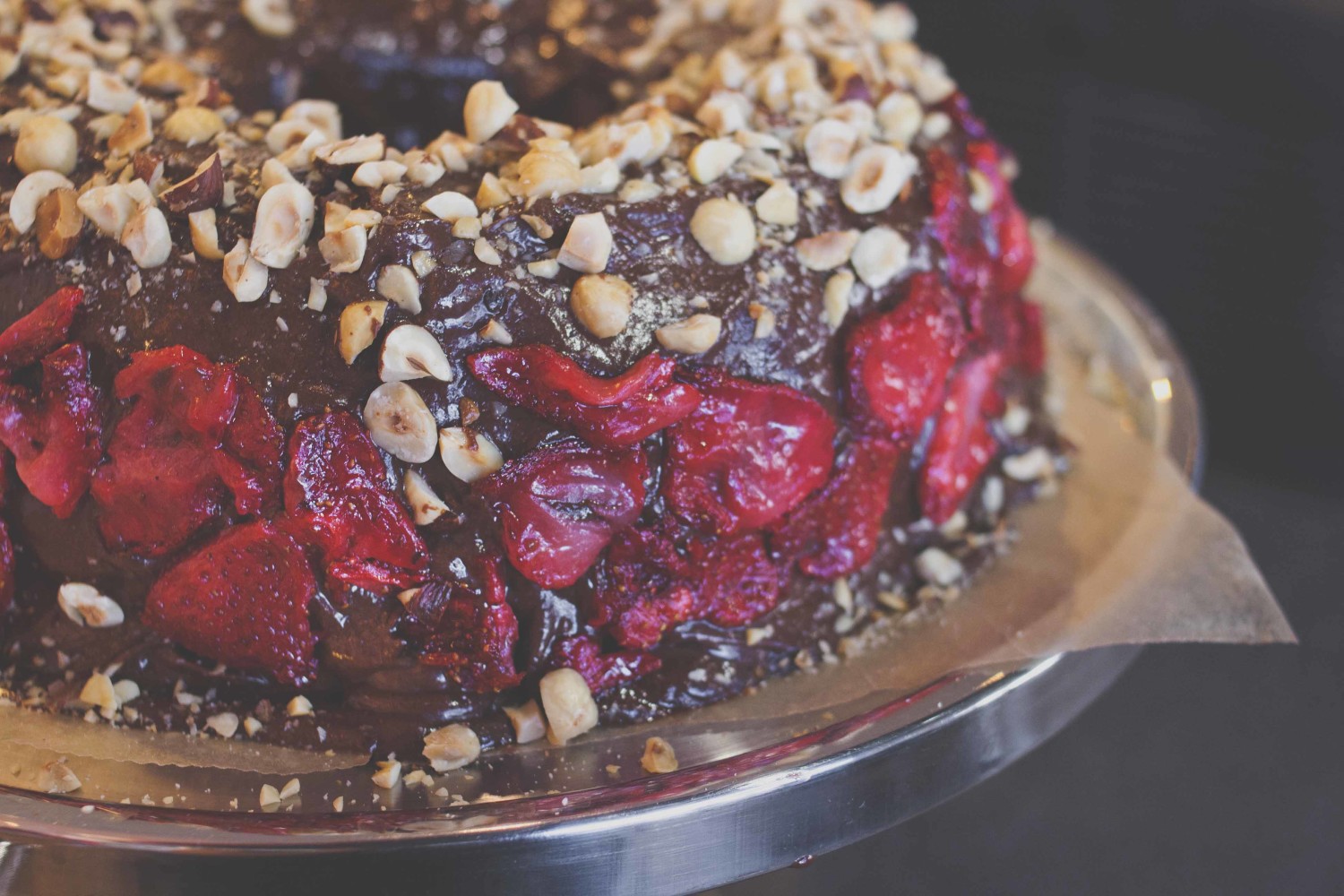 Roasted hazelnut + dark chocolate bourbon cake with sea salt roasted strawberries and dark choc ganache